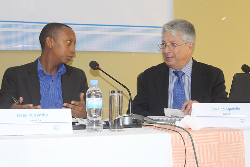 Isaac Rugamba , the external finance mobilizer  chatting with one of UNITAR trainers. (Photos by Michel Nkurunziza)
