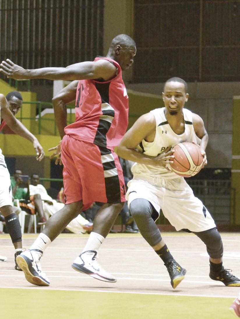 Patriots new signing Hakizimana goes around Bievenue Ngandu of REG in the third quarter. Hakizimana scored 14 points in the 71-57 win on Friday. / Sam Ngendahimana