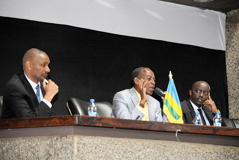Amb. James Kimonyo (C) talks to youth at the Rwanda Youth Forum, on Friday at an event that brought together 500 members of Rwandan youth who live in Kenya. Amb. Kimonyo cautioned the youth not to engage in divisive politics. On the left is Brigadier General Joseph Demari while on the right is Kim Kamasa, an official at the Rwandan Embassy in Kenya. / Courtesy