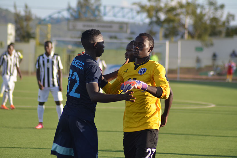 Police substitute keeper Emmanuel Bwanakweli (R), was at fault for APR's equalizer when he failed to clear a back pass. / Sam Ngendahimana