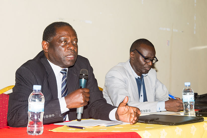 State Minister for Agriculture, Fulgence Nsengiyumva speaks during the meeting as Director for planning, Octave Semwaga looks on. / Faustin Niyigena