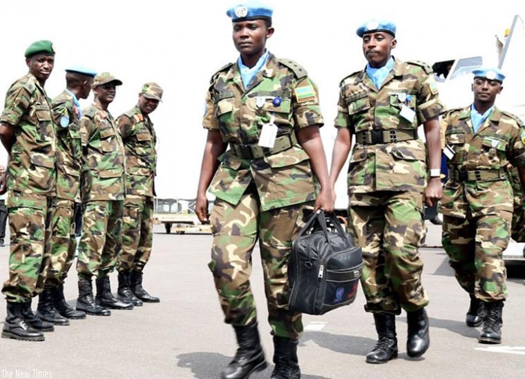 RDF peacekeepers alight from a plane at Kigali International Airport. (File photo)
