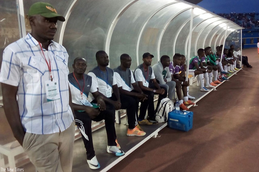 Sunrise FC Nigerian coach Andrew Ibeh, standing left, says he along with his staff and players have not been paid for three months. (Courtesy.)