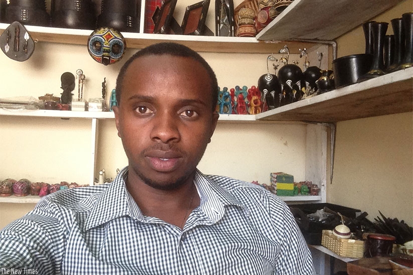 Ishimwe at his crafts shop in Kuri Posta area in the Central Business District.  (Potian Kabeera)