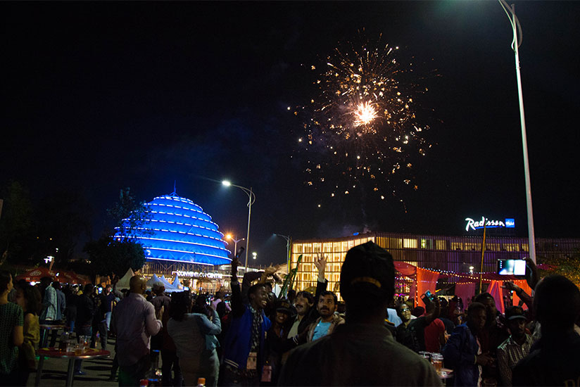Rwandans and other nationals in the country cheer as fireworks light up the skyline around Kigali Convention Centre at the clock of New Year's Day. Several clerics echoed a message....