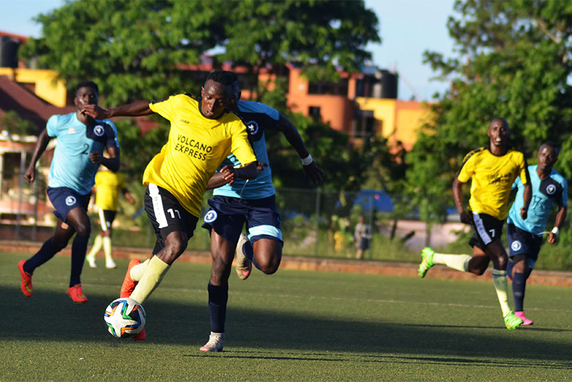 Mukura striker Yussuf Habimana tries to go past Police FC defenders during their league encounter at Kicukiro Stadium last year. / Sam Ngendahimana