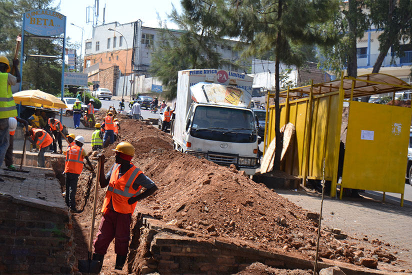 Workers remove electric cables in downtown Nyabugogo to pave way for the city roads upgrade that kicked off yesterday. Officials from HYCOGEC Consultant Ltd, the firm hired to supe....