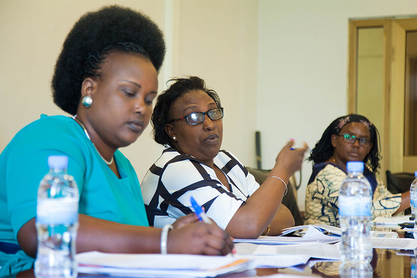 Alphonsine Mukarugema (C), Deputy Chairperson of the Social Affairs Parliamentary Committee, speaks during the meeting as Angelina Muganza (R), Executive Secretary of Public Servic....