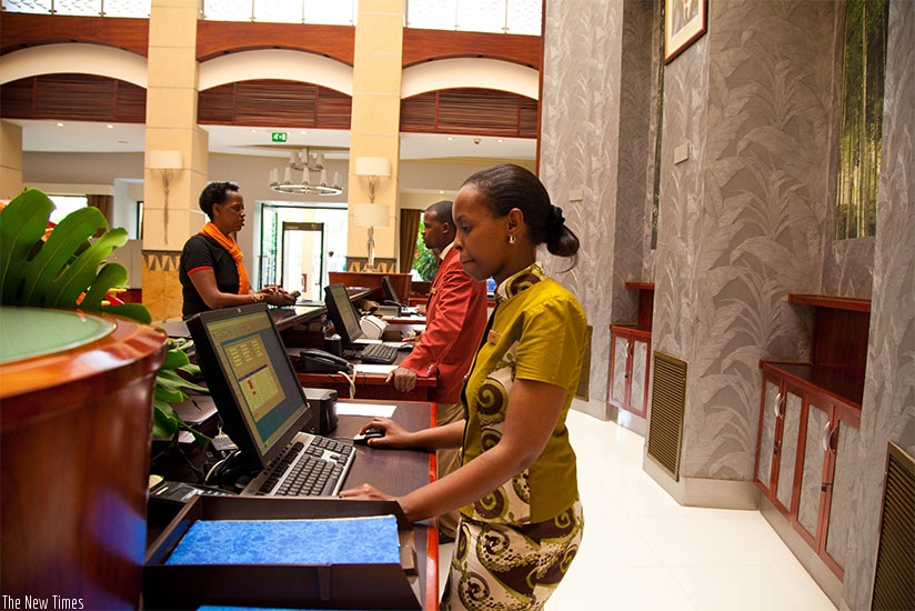 Frontdesk mangers at a Hotel reception in Kigali city. File