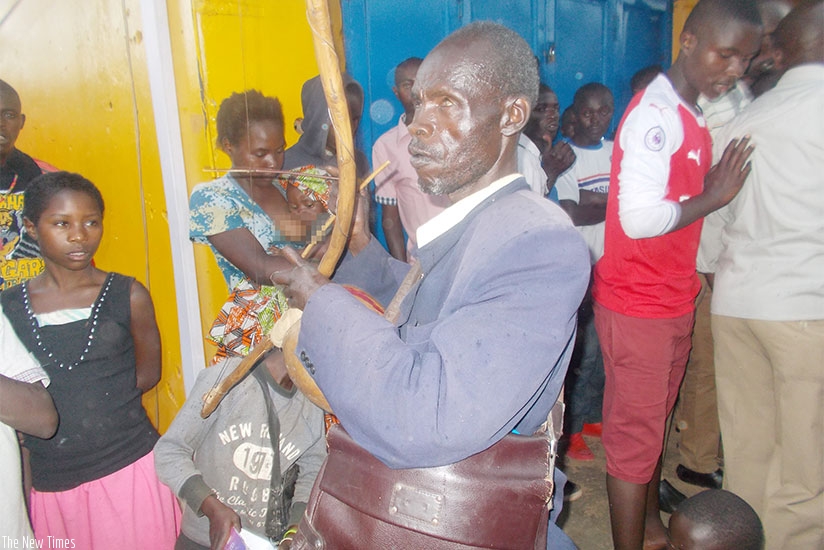  Jean Marie Ngirabagenga plays the umuduri for a living.  Photos by Elias Hakizimana