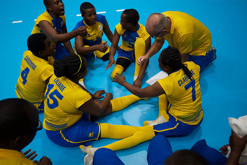 Rwanda women sitting volleyball team head coach Peter Karreman talking to his players during a game in Rio. / Courtesy