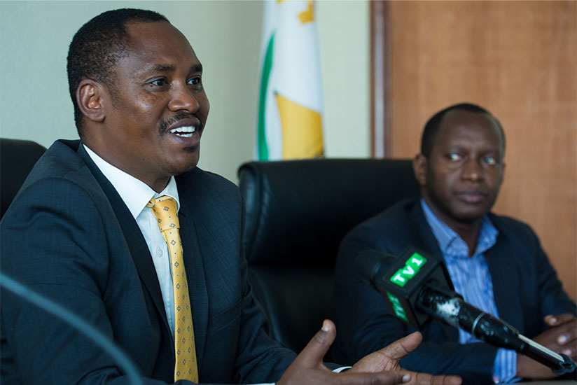 WASAC CEO James Sano (L) addresses media as Yves Bernard Ningabire director general of planning, monitoring and evaluation in local government looks on. / Sam Ngendahimana