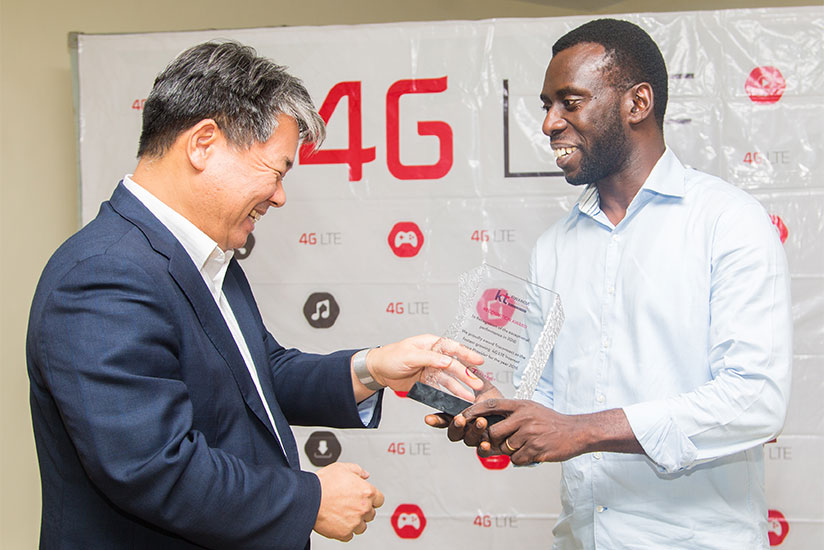 Truconnect Ltd MD, Richard Ruganintwari (R) receives an award from Korea Telecom Rwanda Networks (KTRN) CEO Han-Sung Yoon (Patrick) for being the best 4G internet provider last yea....