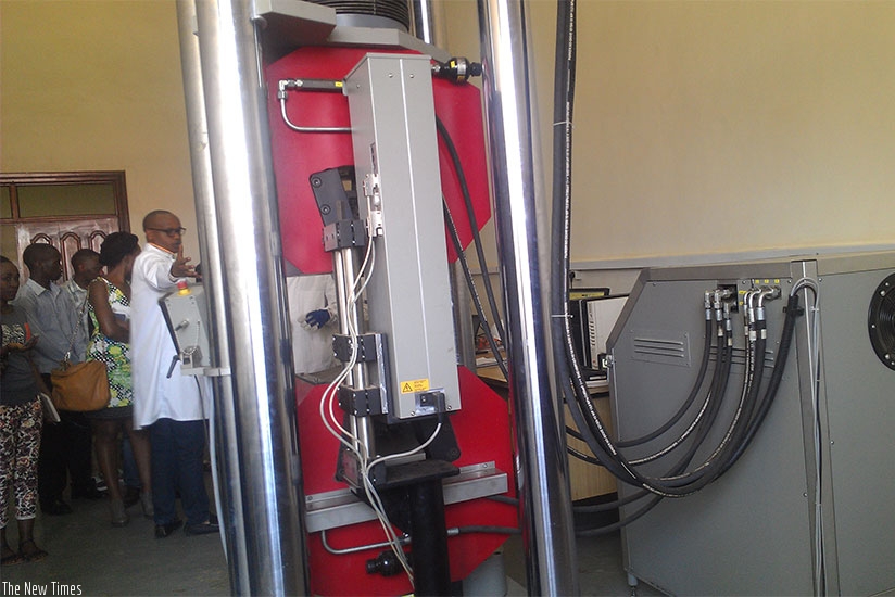 An RSB employee explains how machines are used to test the quality of construction materials work. / File.