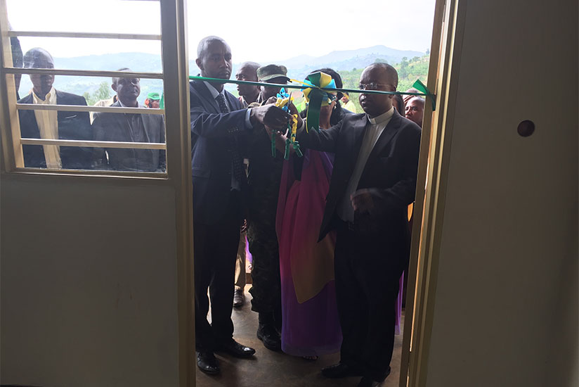 Ruhango mayor Mbabazi and other guests cut a ribbon at the launch of the nursery school. / Courtesy
