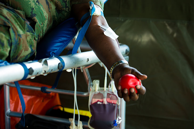 An RDF officer donates blood at Kanombe Military Barracks in Kigali. / Timothy Kisambira