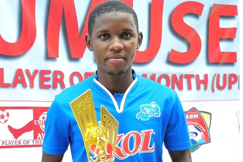 Shassir Nahimana with his award. Courtesy