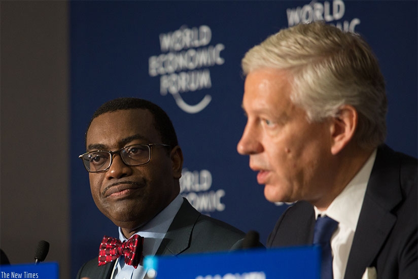 African Development Bank president Akinwumi Adesina(L) and Dominic Barton, global managing director, McKinsey & Company, address the media in Kigali last year. File.