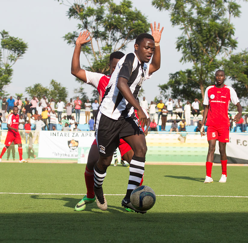 APR forward Muhadjir Hakizimana takes on Kirehe defender during the recent league match. / Timothy Kisambira