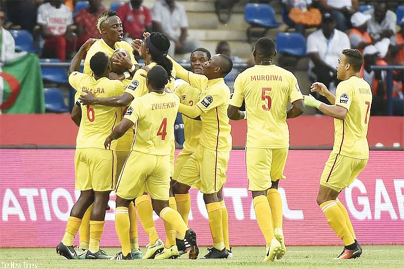 Zimbabwe celebrate after equalising against Algeria.