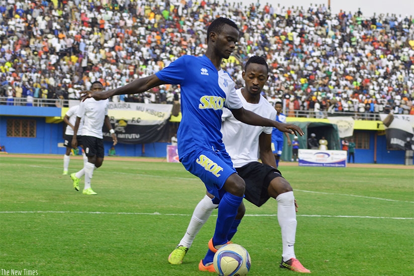 Rayon Sports' Djabel Manishimwe controls the ball against Issa Bigirimana of APR FC during the Peace Cup final last year. File