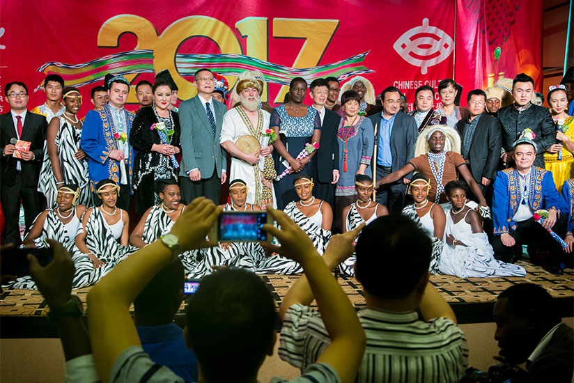Minister Julienne Uwacu (C) and the Chinese Embassy officials in a group photo with the Urukerereza cultural dance troupe after the festival on Thursday at Serena Hotel in Kigali. ....