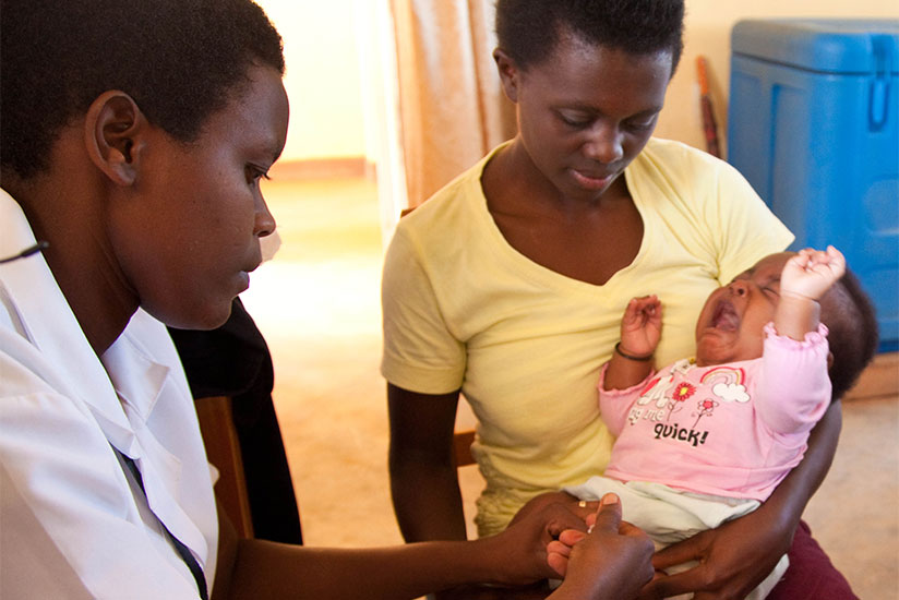 A nurse immunises a child at Busanza Health Centre in Kanombe. / File