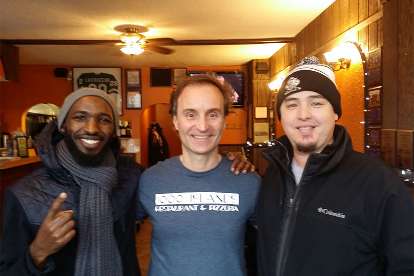 Musabimana with friends in Canada.