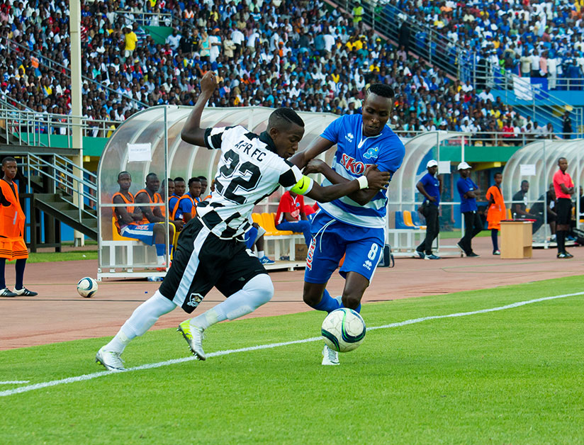 Michel Rusheshangoga (left) was handed the captain's armband for the game against Rayon Sports. APR won 1-0 to go top of the table on Saturday. / Timothy Kisambira