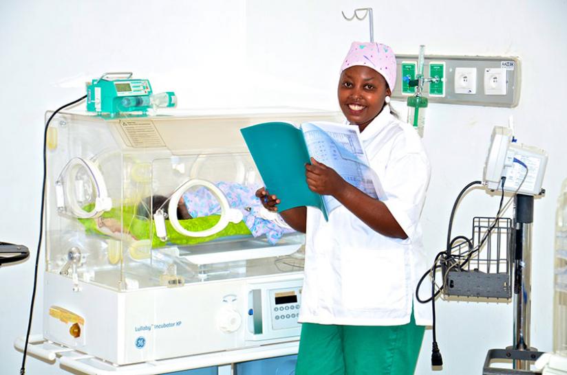 An intensive care pediatric nurse attends to premature newborns in a Kigali hospital. File.