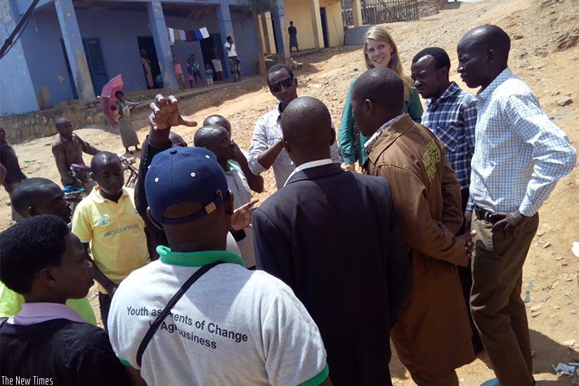 Rwanda Youth Agribusiness Forum members and FAOu2019s Holtslag during the tour. / Appolonia Uwanziga.  