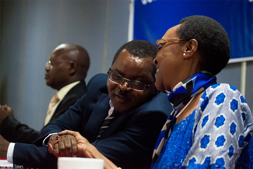Munyeshaka (L) and Ingabire exchange greetings during the launch of the report in Kigali yesterday. (Photos by Timothy Kisambira)