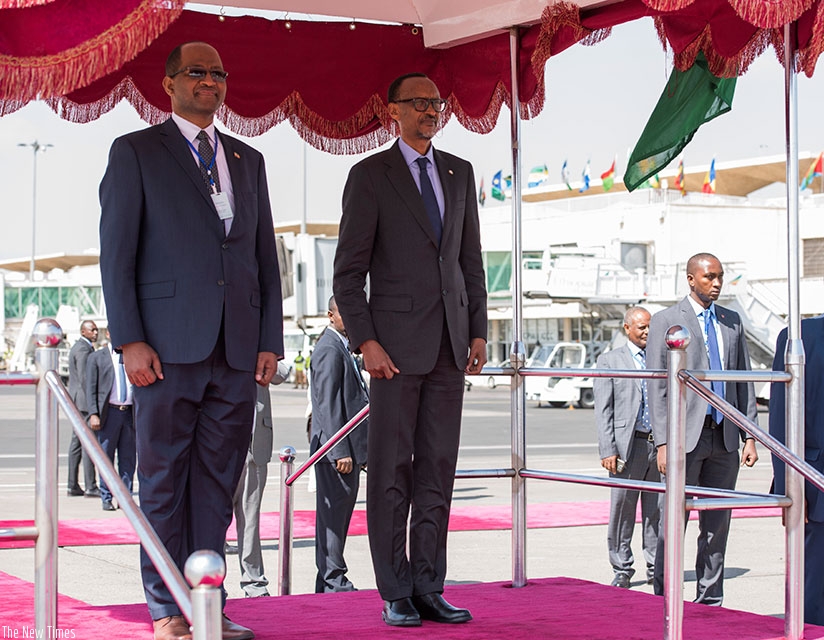 President Kagame and Ethiopia's Minister for Public Service and Human Resource Development Tagesse Chafo listen to the national anthem yesterday shortly after the President and Fir....