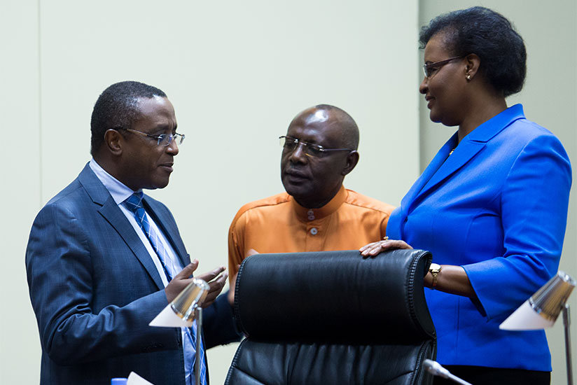 Minister Biruta (L) speaks to Speaker Mukabalisa (R) and her deputy Abbas Mukama after presenting the draft law in Parliament last week. / Timothy Kisambira
