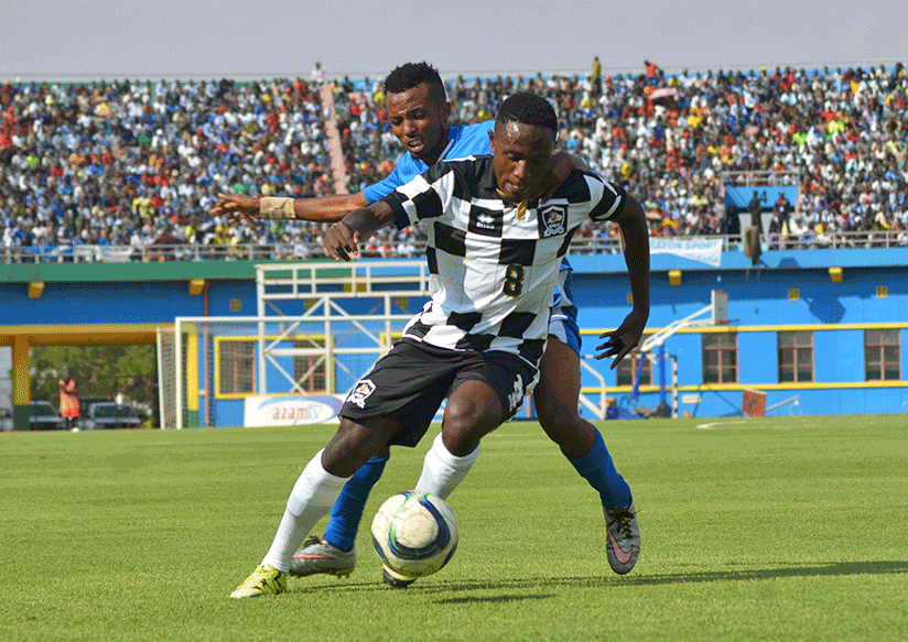 APR FC midifielder Djihad Bizimana dribbles past Rayon Sports winger Savio Nshuti during their first 2016/17 league clash that the army side won 1-0 at Amahoro stadium over a week ....