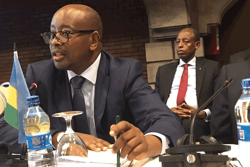 Minister Musoni speaks at the meeting in Nairobi, while Rwanda's High Commissioner to Kenya, James Kimonyo, looks on. 