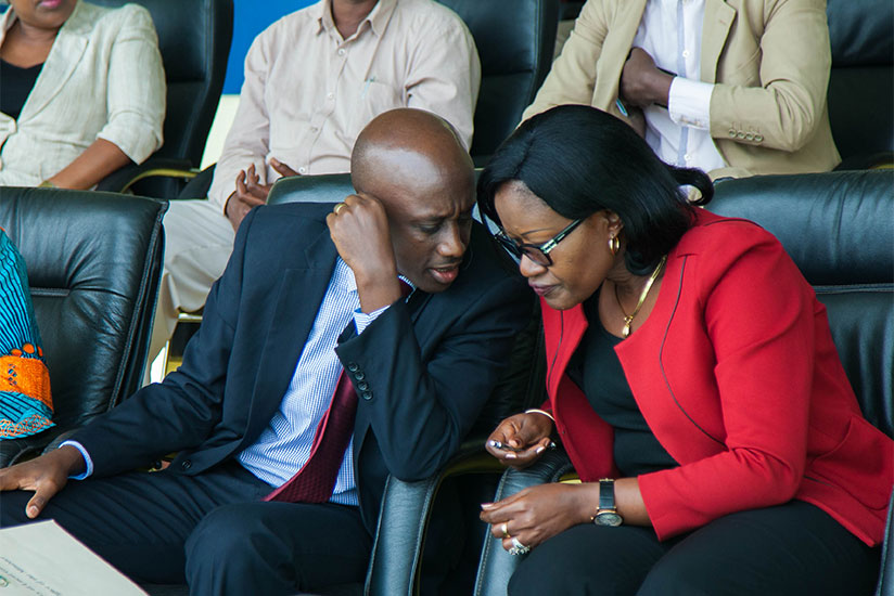 Local Government minister Francis Kaboneka chats with City of Kigali mayor Monique Mukaruliza during a meeting with Nyarugenge local leaders in Kigali yesterday. Kaboneka urged the....