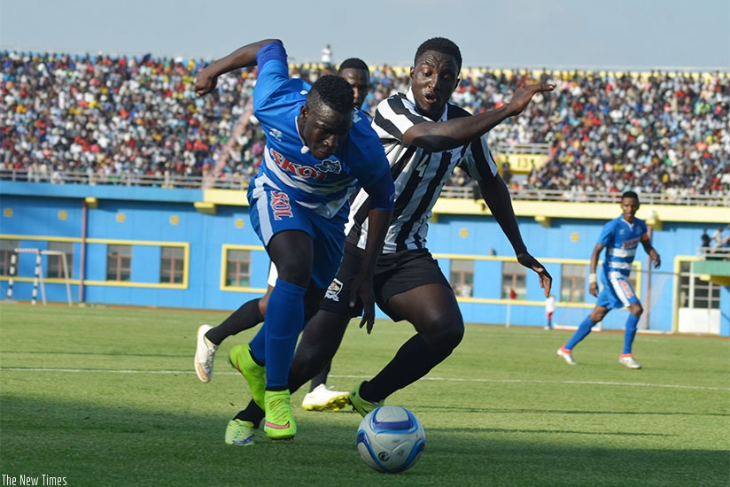 APR defender Helve Rugwiro, keeps Rayon Sportsu2019 Malian forward Moussa Camara in check. Rugwiro netted the only goal of the match. S. Ngendahimana