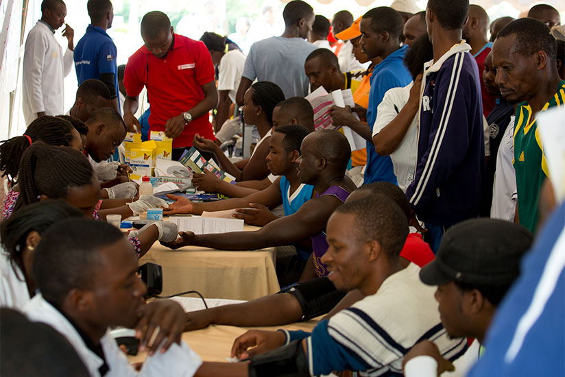 Volunteers undergo free medical examination during the activities. / Timothy Kisambira