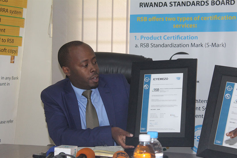 Raymond Murenzi, the director general of Rwanda Standards Board, holding the certificate. (Photos by Frederic Byumvuhore)rn