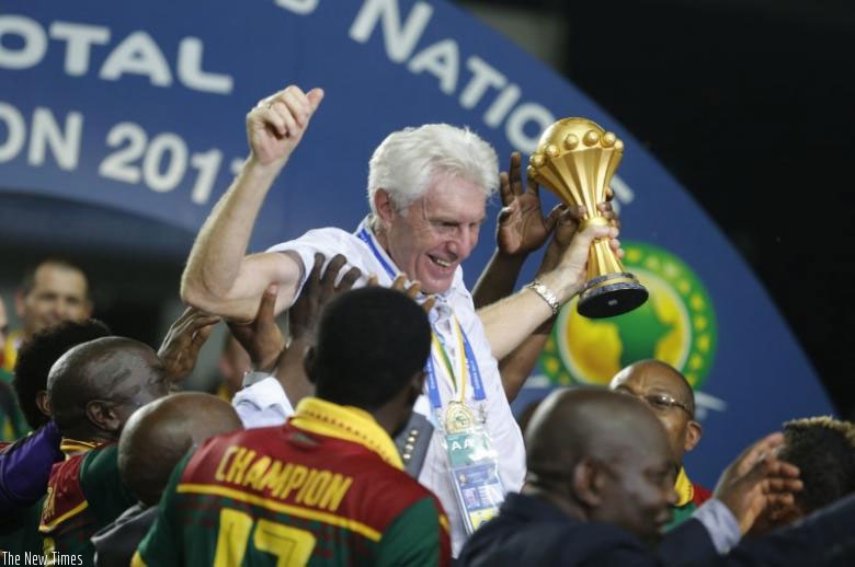 Cameroon coach Hugo Broos celebrates with the trophy.