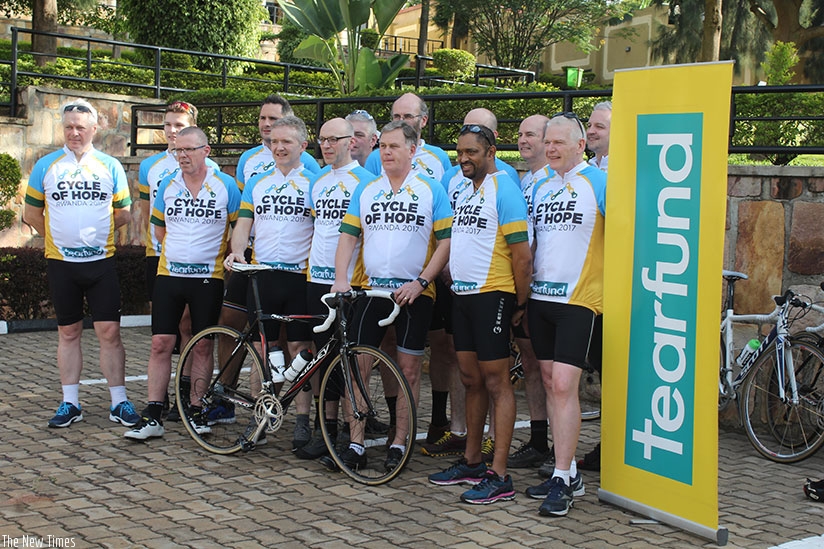 Tearfund UK representatives that will take part in the three-day bike tour pose for a photo at Nobleza Hotel on Monday. Geoffrey Asiimwe