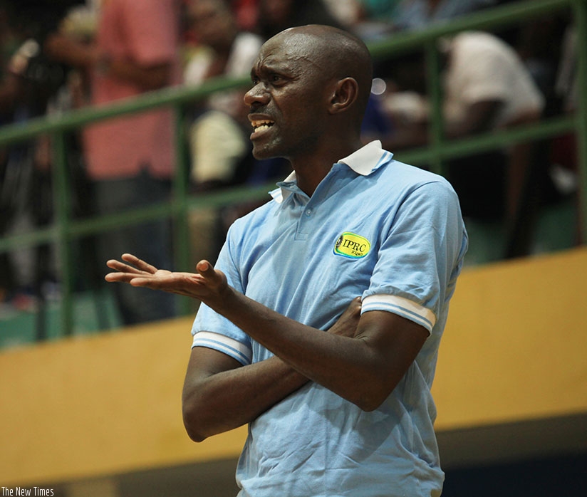 IPRC-Kigali head coach Albert Buhake gives instructions to his players during the Heroes' Day final match against Espoir on Sunday. Sam Ngendahimana.