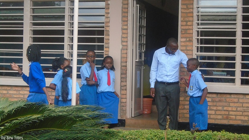 A teacher talks to his pupils. Teaching is touching the lives of your students, making connections that will last a lifetime. / Lydia Atieno