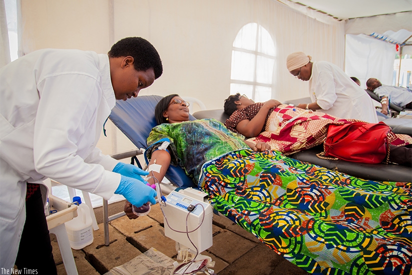 Volunteers donate blood at Car-Free Zone in Kigali last year. The National Centre for Blood Transfusion has received Level Three accreditation, the top most level that African Soci....