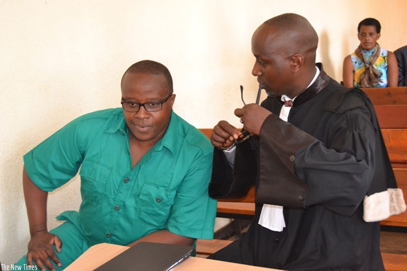 Genocide suspect Henri Jean-Claude Seyoboka with his lawyer, Albert Ngirabatware (File)