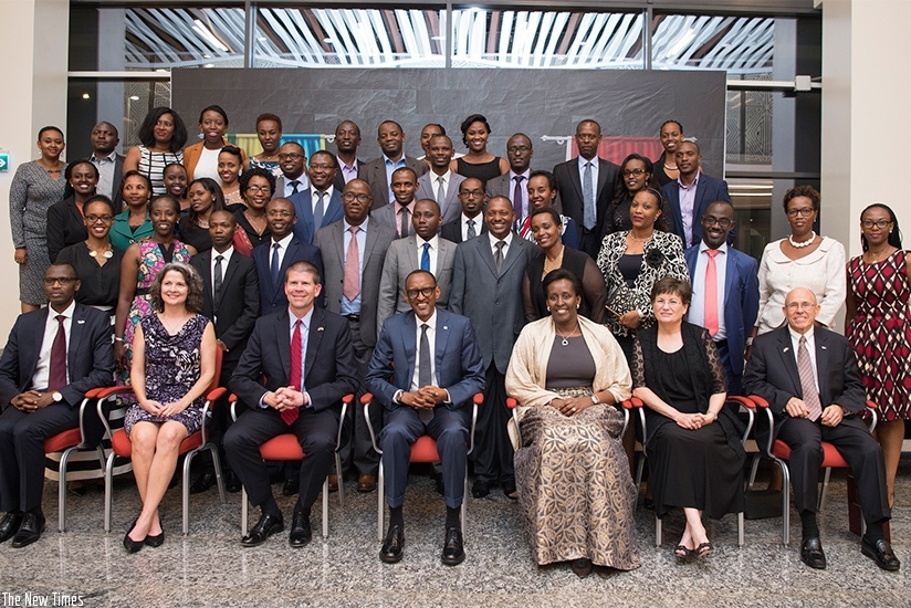 President Paul Kagame and First Lady Jeannette Kagame are joined by other officials in a group photo during the event to celebrate a decade-long partnership between Oklahoma Christ....