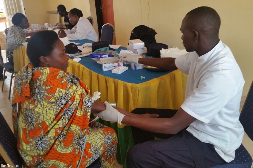 A member of community policing committee in Karongi testing her HIV status