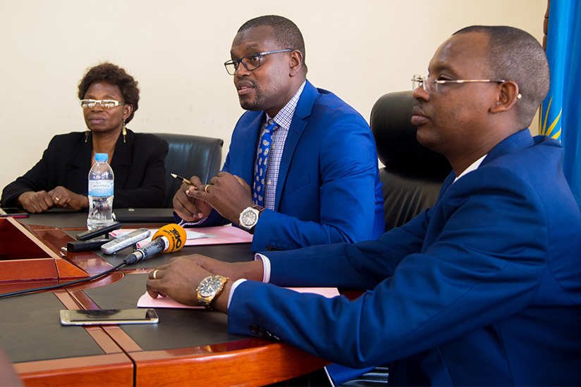 Mutangana addresses the media as his deputy Mukagashugi (L) and Inspector General of the Prosecution Ntete look on. (Faustin Niyigena)