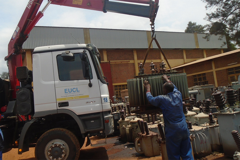 EUCL workers load transformers on a truck. (Photos by Michel Nkurunziza.)